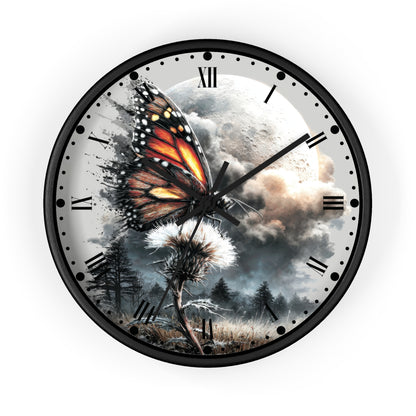 A round wall clock with a black frame and a surreal printed dial showing a monarch butterfly over a dandelion, a full moon, cloudy sky, and dark trees. Roman numerals mark the hours, and the clock is centered on a light gray background.
