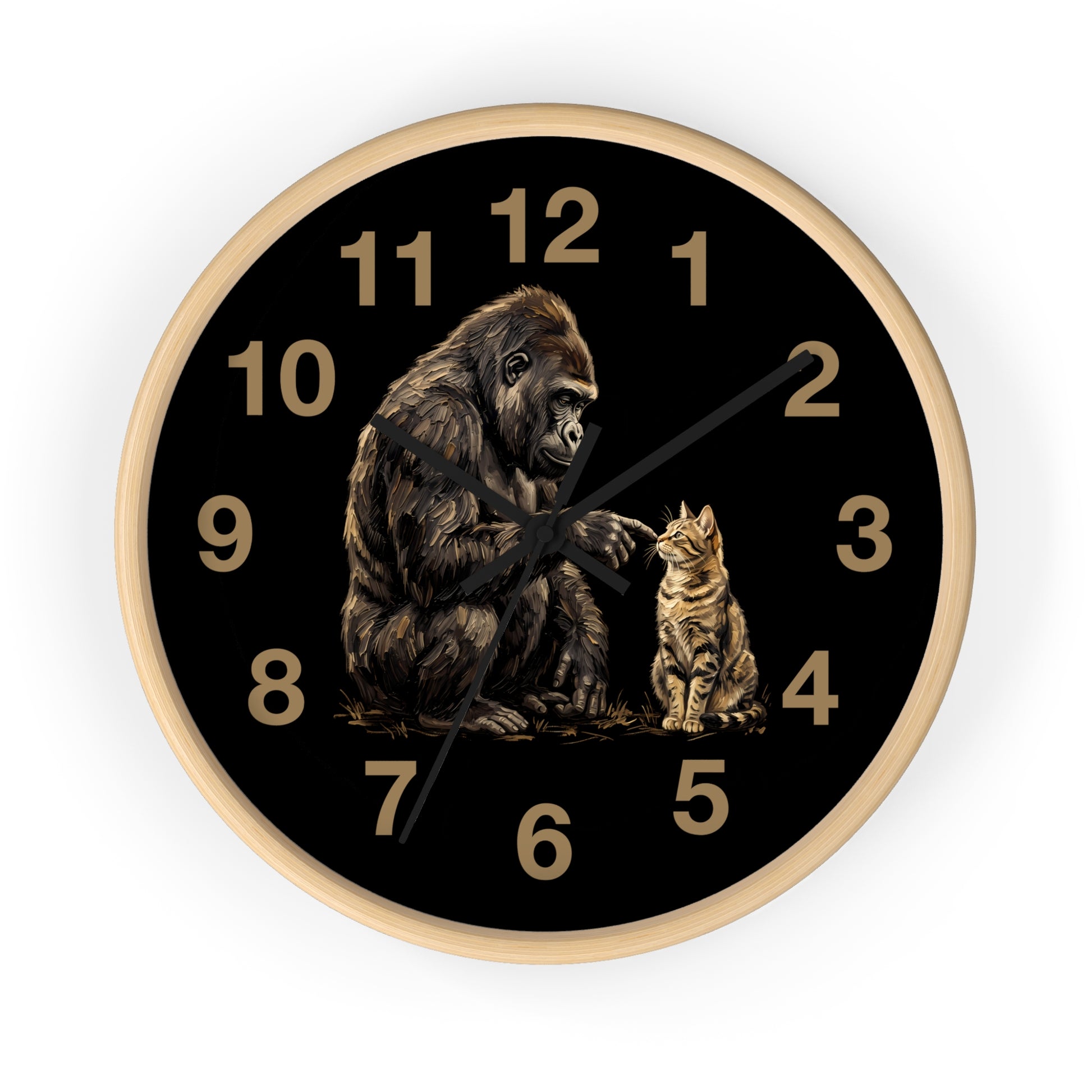 A round wall clock with a black face, gold Arabic numerals, black hands, and an illustration of a gorilla and a cat on the lower half. The clock has a light wood-toned frame and is shown against a plain white background.