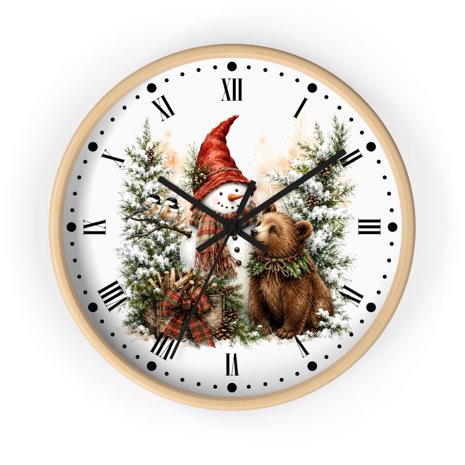 A round wall clock with a light wood frame and a white face featuring a winter holiday illustration of a snowman in a red hat among snowy trees, with a brown bear at the center. The clock is shown against a plain white background.