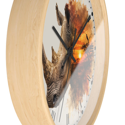 Round wall clock with a light natural wood frame and a printed face featuring a rhinoceros head over an abstract orange sunset scene, shown on a white background.