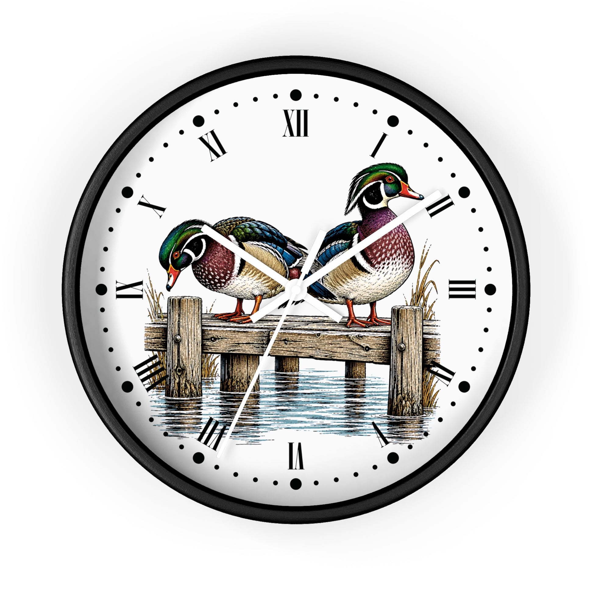 A round wall clock with a black frame and a white face featuring an illustration of two mallards on a wooden dock over water, with black Roman numerals and white hands.