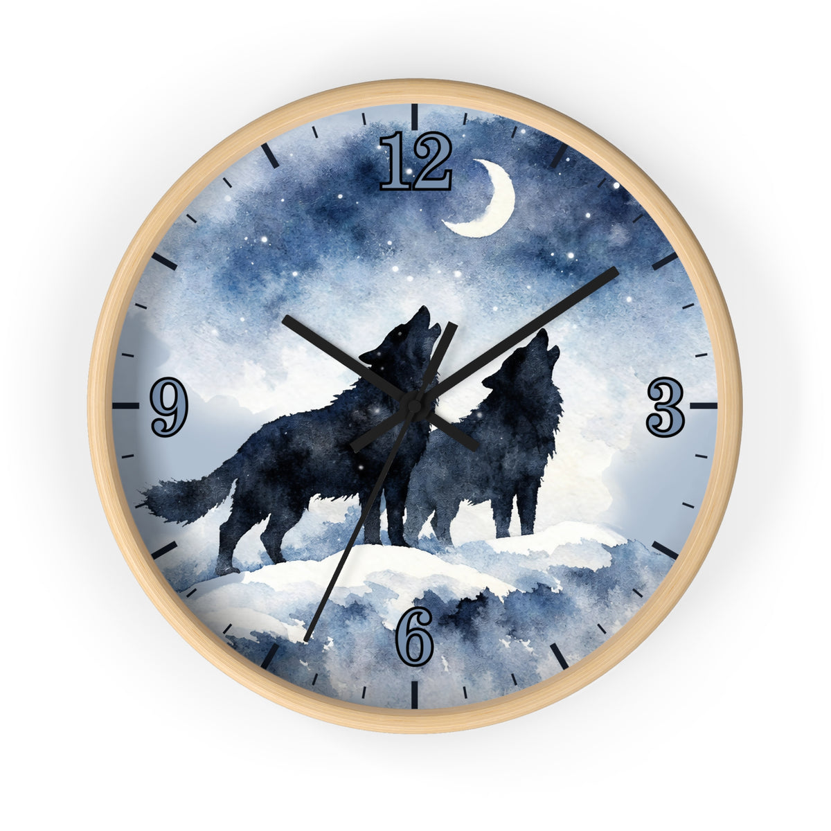 Round wall clock with a light wood frame and a printed night sky dial showing two black wolf silhouettes howling under a crescent moon and stars. The clock has blue-toned watercolor-style graphics, black numerals, and black hands, photographed on a plain white background.