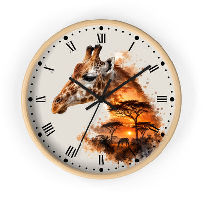 A round wall clock with a light wood frame and a cream-colored face, featuring a giraffe head and an African savanna sunset scene printed on the dial. The clock has black Roman numerals and hands, shown against a plain white background.
