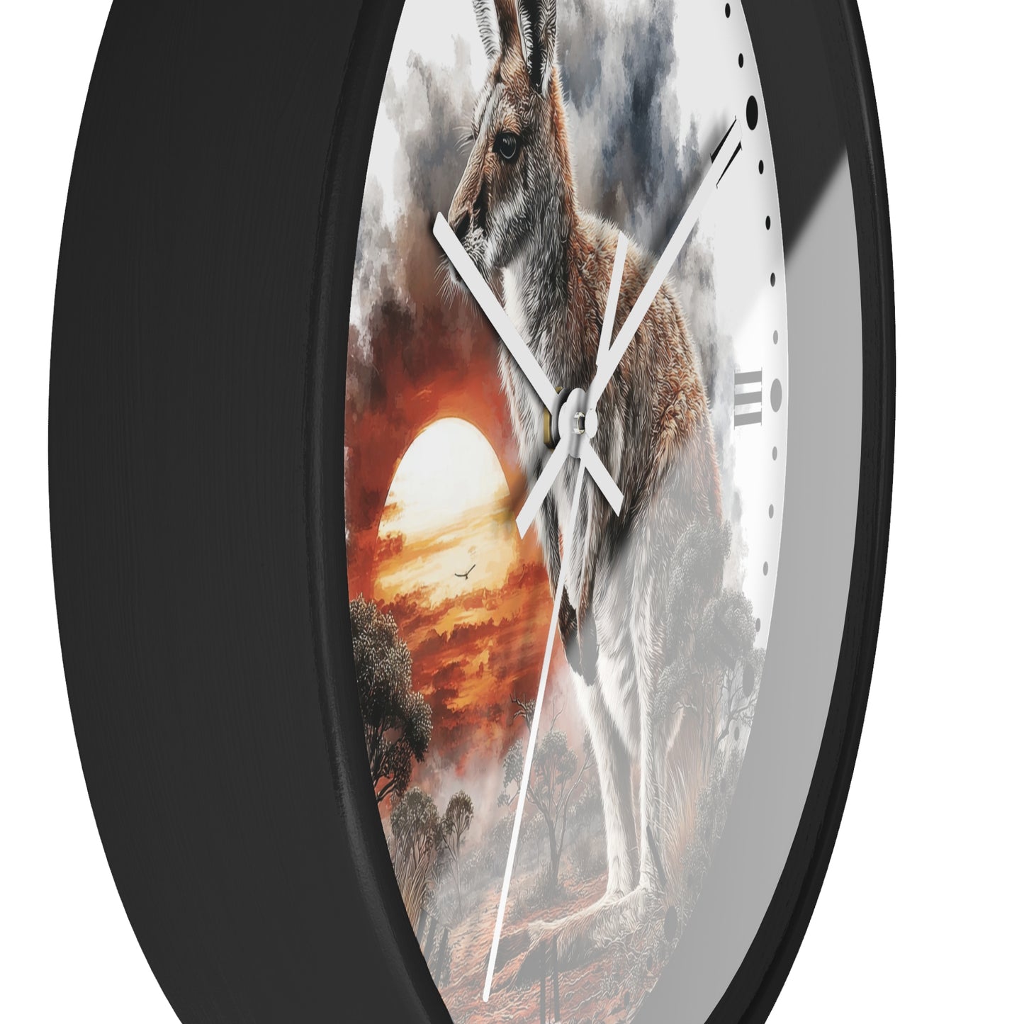 A close-up of a round wall clock with a black frame and a printed scenic face showing a kangaroo against a dramatic sunset sky.