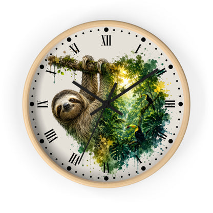 A round wall clock with a light natural wood frame, featuring a watercolor-style tropical jungle design with a sloth, toucan, and green foliage on the face. The clock has black Roman numerals, black minute markers, black hands, and a white background.
