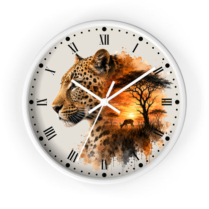A round wall clock with a white frame and a printed safari design featuring a leopard, trees, and an orange sunset over a savanna, with black Roman numerals and clock hands on a white face.