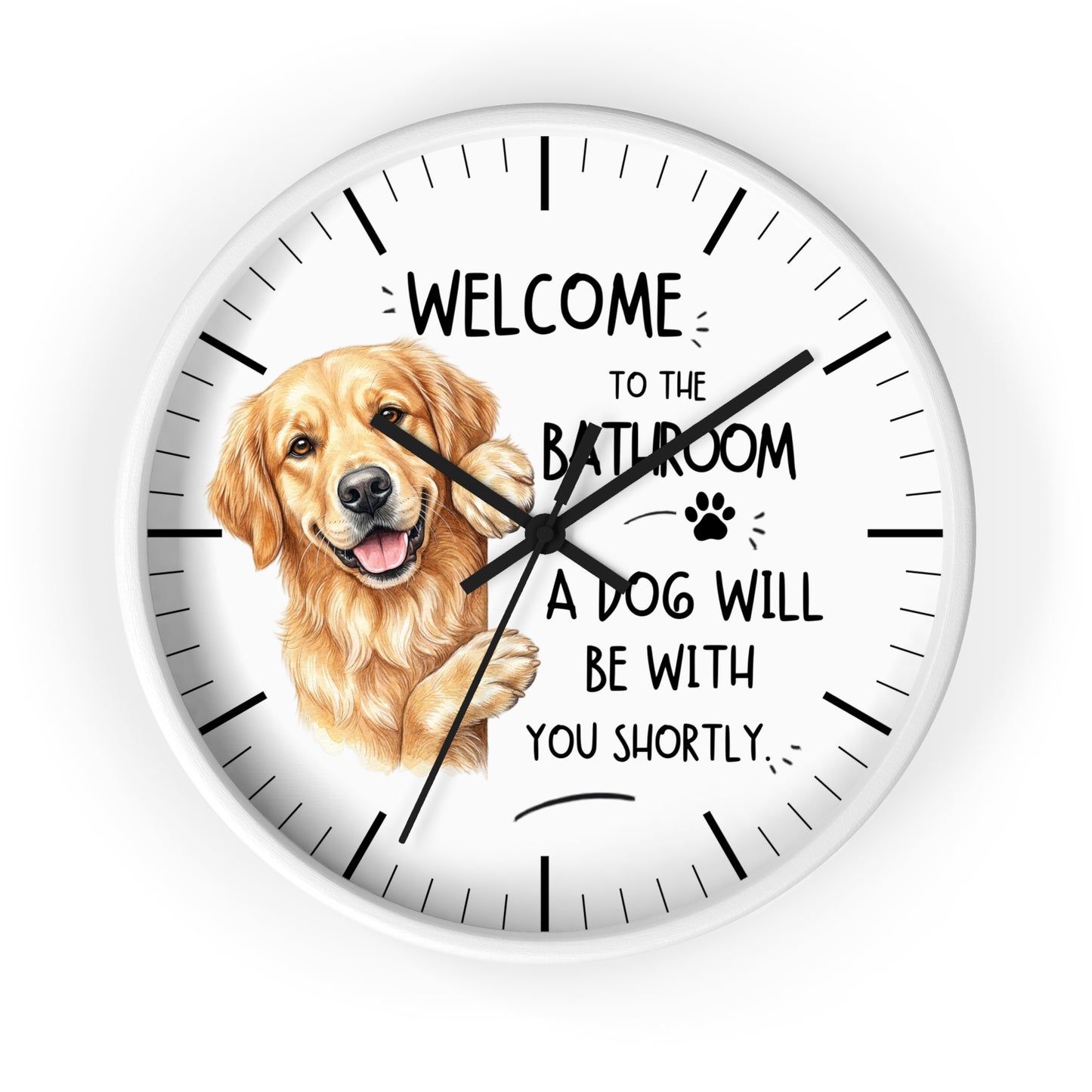 A round white wall clock with black hands and hour markers, featuring a golden retriever illustration and the text 'WELCOME TO THE BATHROOM A DOG WILL BE WITH YOU SHORTLY' on a white background.