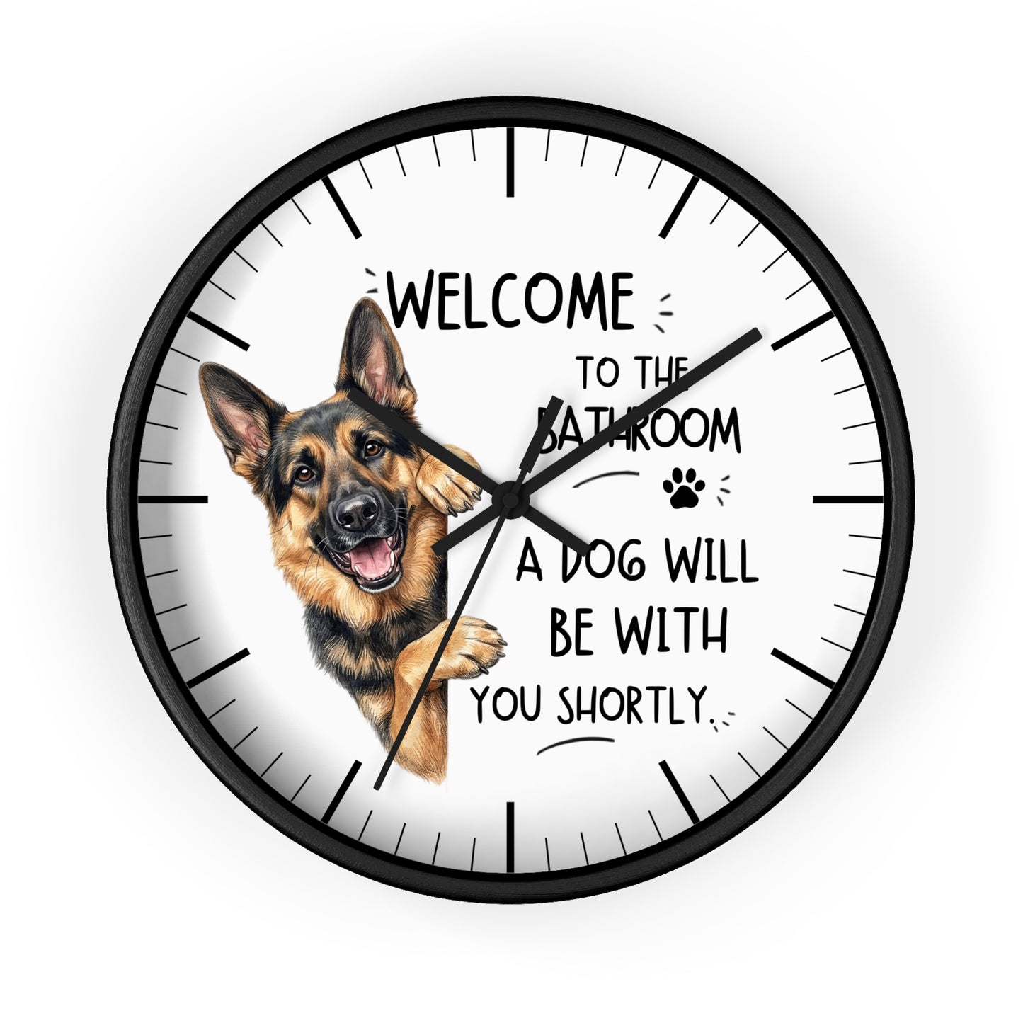 A round wall clock with a black frame and white face, featuring a German Shepherd illustration and the text 'WELCOME TO THE BATHROOM A DOG WILL BE WITH YOU SHORTLY.' on a light gray background.