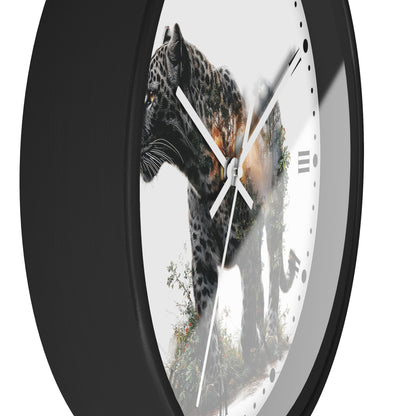 A close-up of a round wall clock with a black frame and a white face featuring a photographic print of a leopard with a warm light overlay. The clock is shown against a plain white background.