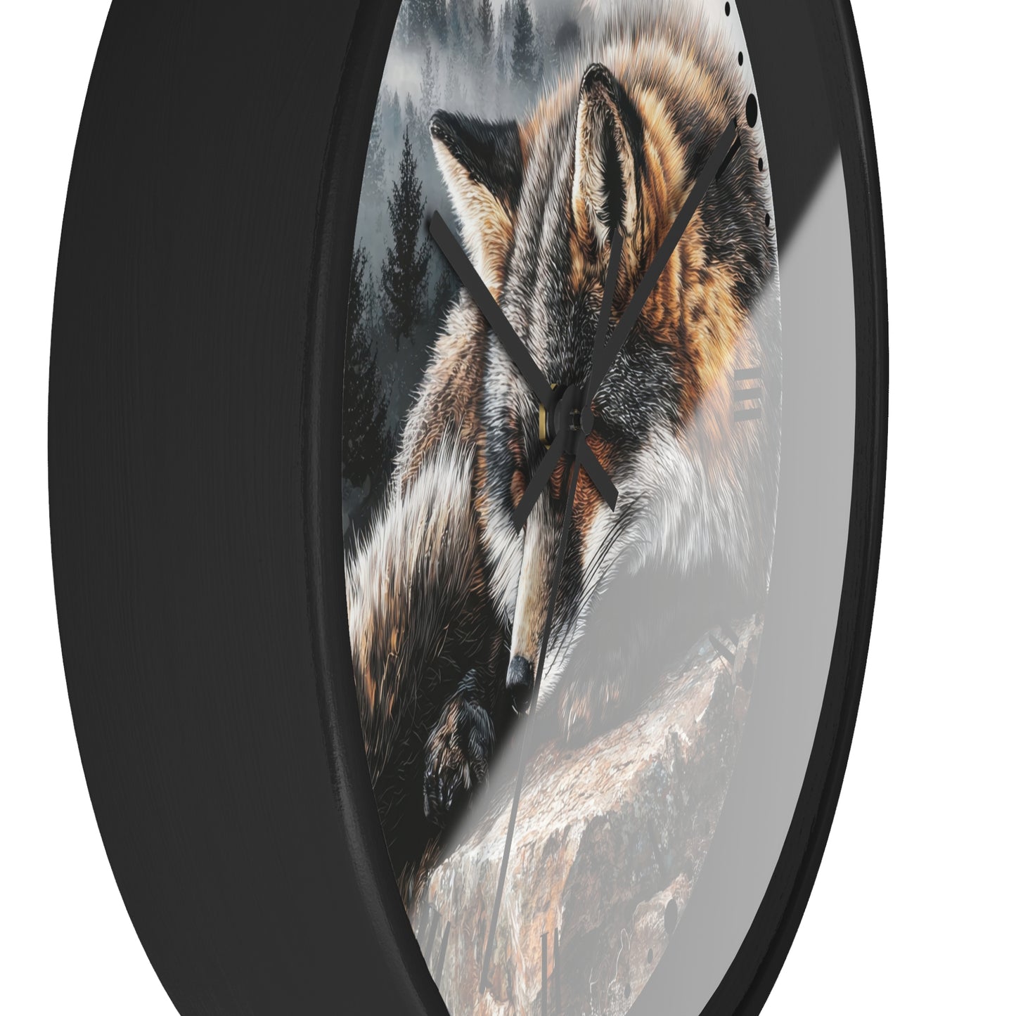 A round wall clock with a black frame and a printed design of a fox resting on a rock against a forest background.