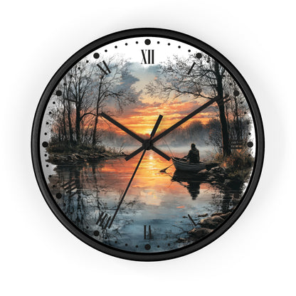 Round wall clock with a black frame and a scenic print of a lake at sunset, featuring a person in a boat and bare trees, with black Roman numerals and hands on a white background.