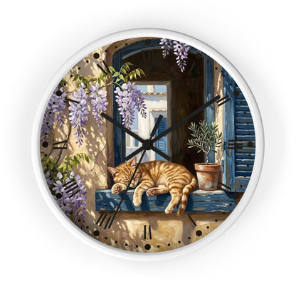 A round wall clock with a white frame, featuring a painted scene of an orange tabby cat sleeping on a blue window sill beneath purple wisteria flowers.