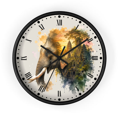 A round wall clock with a black frame and a printed face featuring a watercolor-style elephant merging into a temple scene with gold, green, and blue tones on a light background.