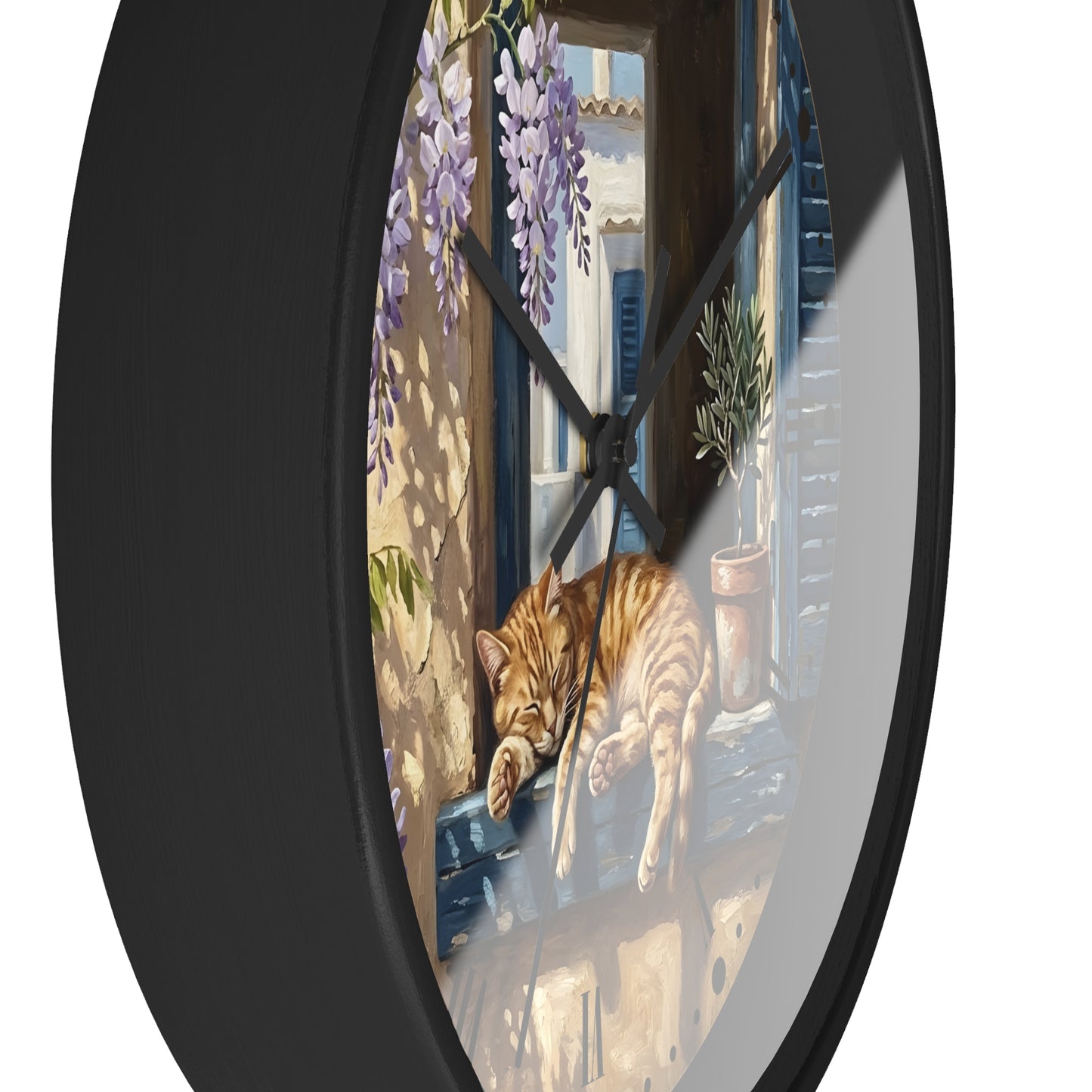 Round wall clock with a black frame and a printed illustration of an orange tabby cat sleeping on a windowsill, with purple wisteria and a sunlit balcony scene.
