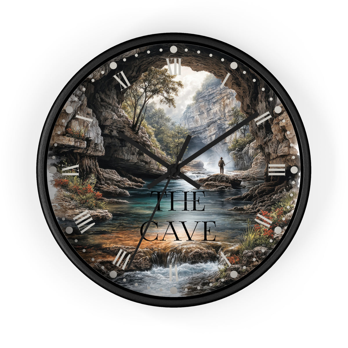 A round wall clock with a black frame and a scenic cave landscape print, featuring the text 'THE CAVE' over the center. The clock is shown against a plain white background.