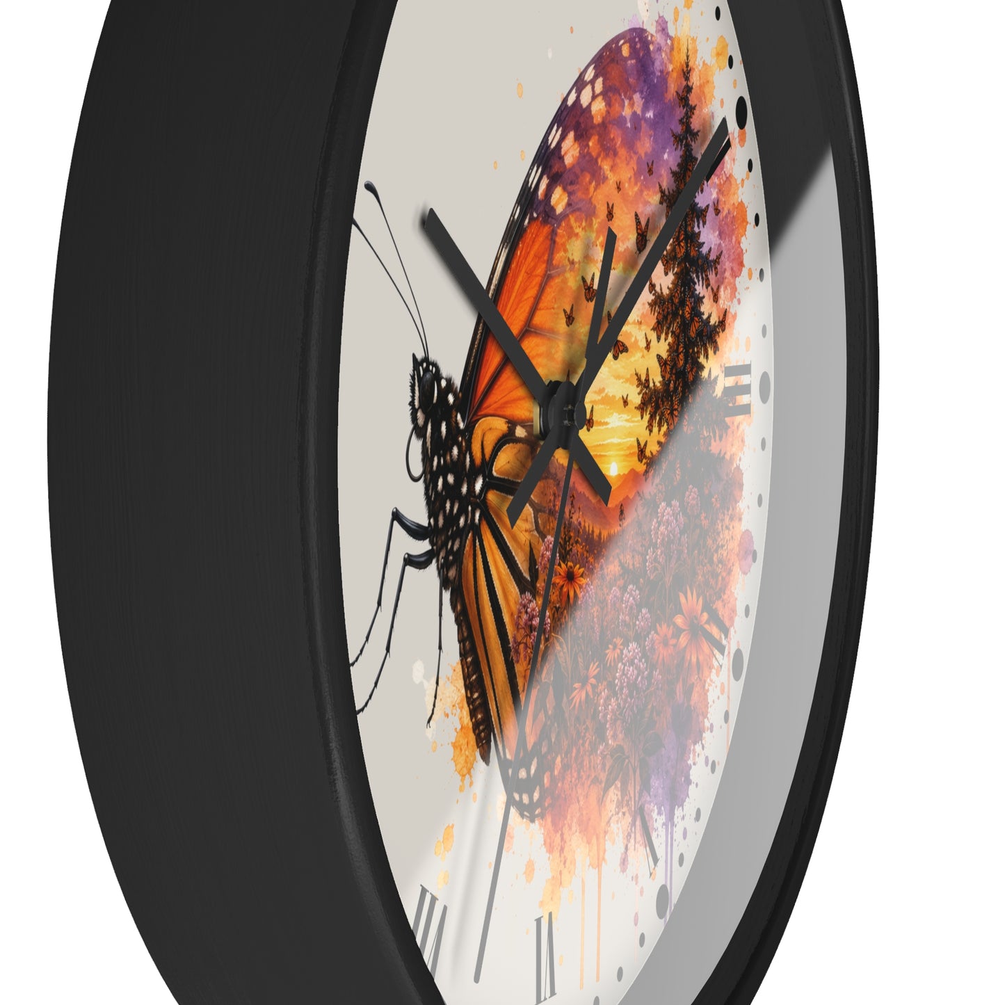 A close-up of a round wall clock with a black frame and a white dial featuring a stylized butterfly and floral artwork in orange, purple, and yellow tones.