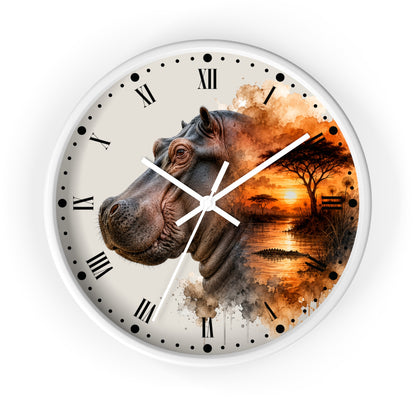 A round wall clock with a white frame and a printed design featuring a hippopotamus head on the left and an African savanna sunset scene on the right. The clock face is off-white with black Roman numerals and white hands, shown against a plain white background.