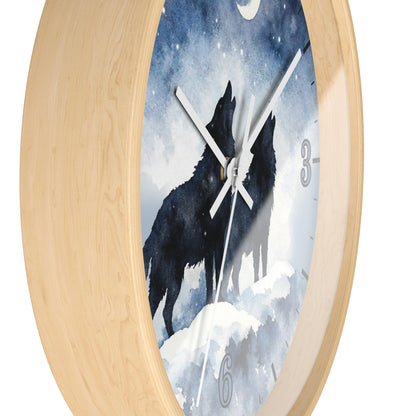 Round wall clock with a light natural wood frame and a printed face showing two black howling wolves under a snowy blue night sky. The clock has white hands, a moon at the top, and partial gray numerals at 3 and 6.