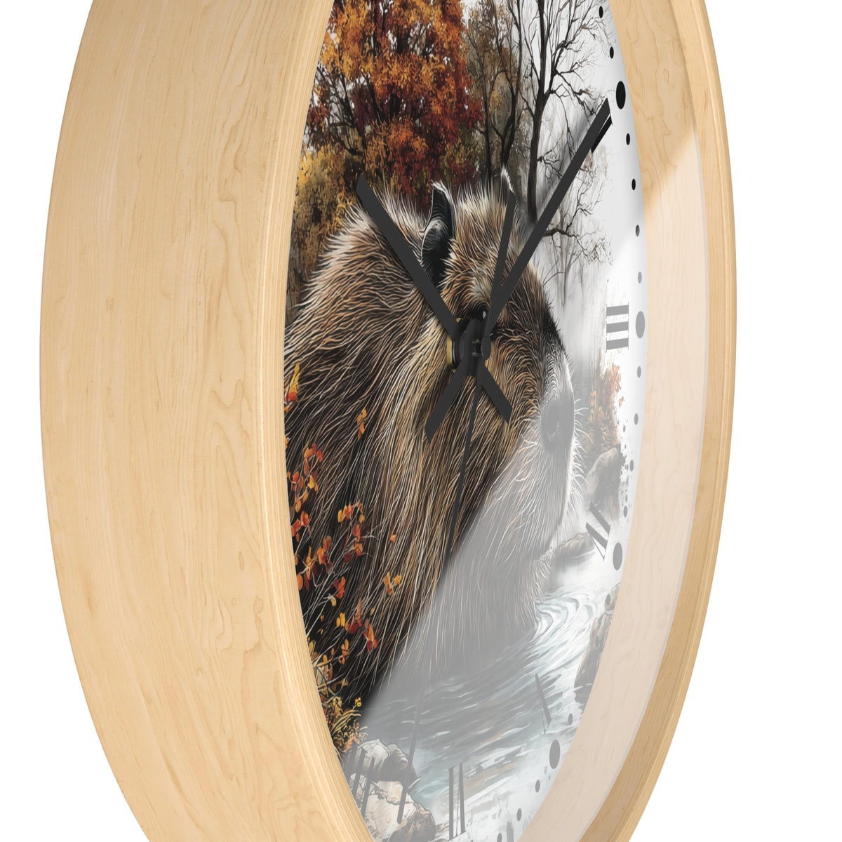 Round wall clock with a light natural wood frame and a printed face showing a capybara in an autumn forest scene, photographed on a white background.