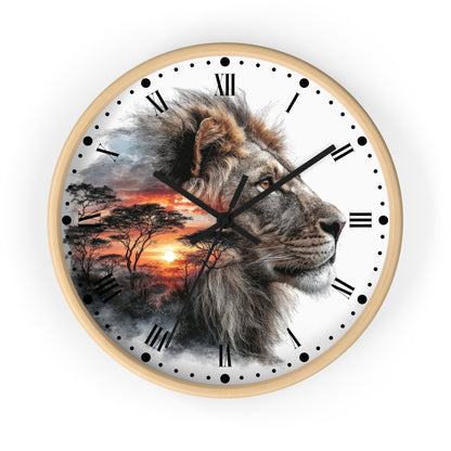 A round wall clock with a light wood frame, featuring a printed design of a lion's face over an African savanna sunset scene with black Roman numerals and hands on a white background.