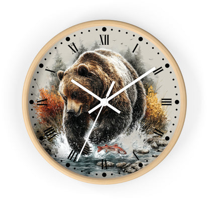 Round wall clock with a white frame and a printed design of a brown bear walking through water with autumn trees and a red salmon fish on the face, Roman numerals for hours, and white clock hands.