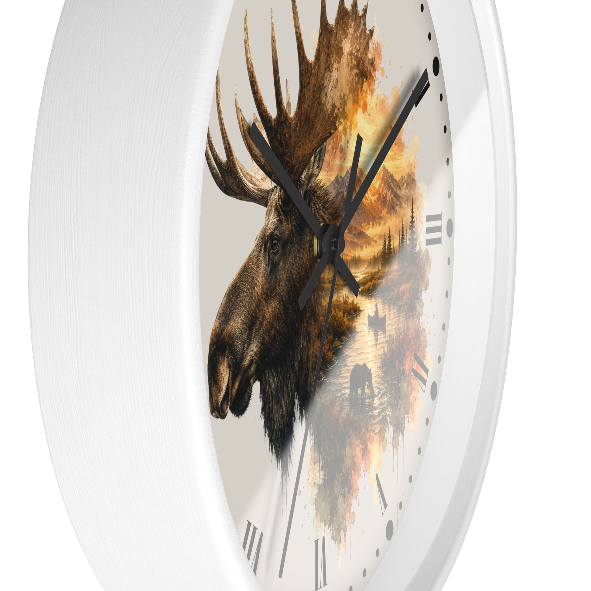 A round wall clock with a white frame and a printed moose head over a scenic landscape design on the face, shown against a plain white background.