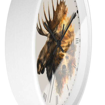 A round wall clock with a white frame and a printed moose head over a scenic landscape design on the face, shown against a plain white background.
