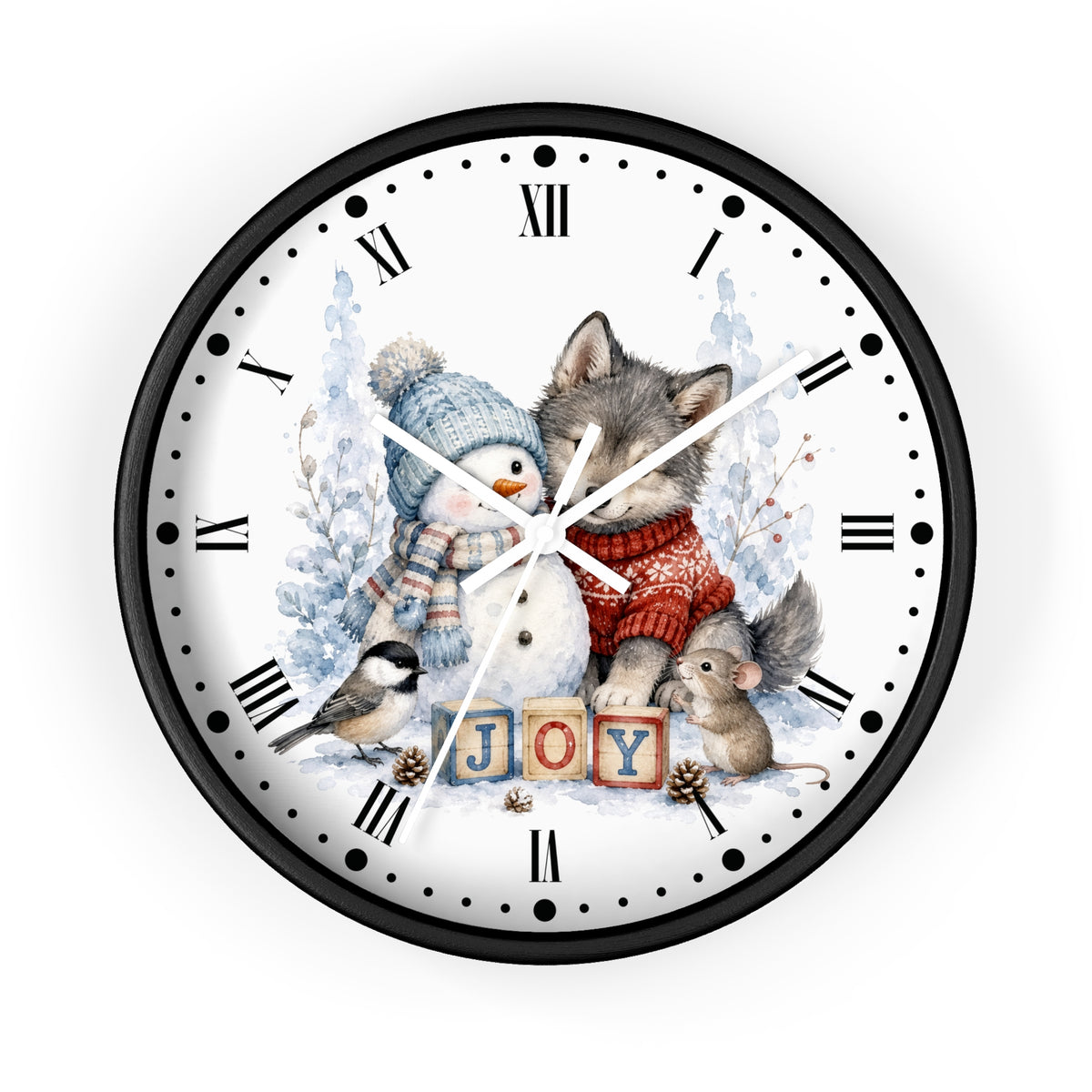 A round wall clock with a black frame and a white face featuring a winter illustration of a wolf, snowman, bird, mouse, and the word "JOY" in wooden blocks. Roman numerals mark the hours, with black hands and small dot markers around the edge.