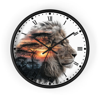 A round wall clock with a black frame and Roman numerals, featuring a printed design of a lion's profile over an African savanna sunset scene on a white clock face.