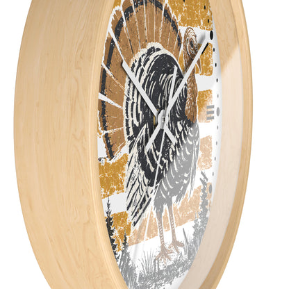 Round wall clock with a light natural wood frame and a rustic turkey illustration in black, white, and mustard yellow on the dial, shown against a plain white background.