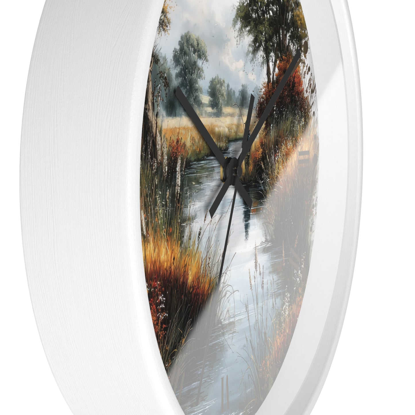 Round wall clock with a white frame and a scenic landscape print of a stream running through a grassy field, featuring black hands.