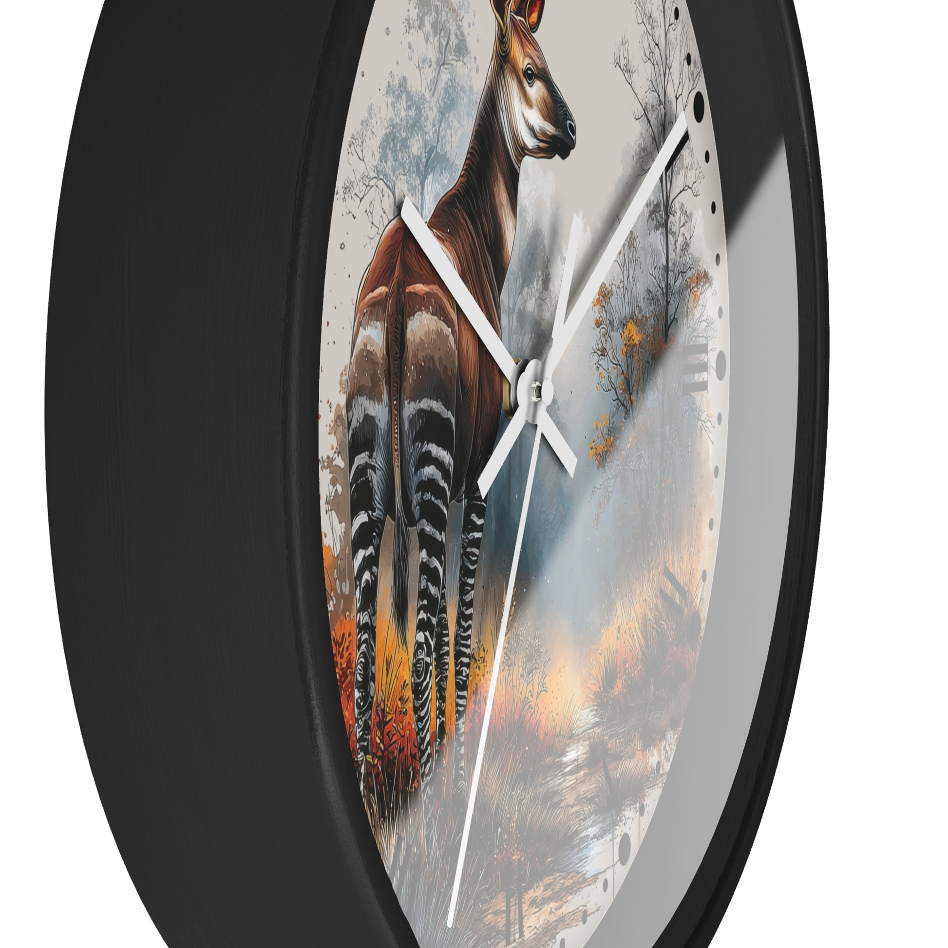 Round wall clock with a black frame and a printed nature scene featuring a brown antelope standing in a misty forest, with white clock hands on a white background.