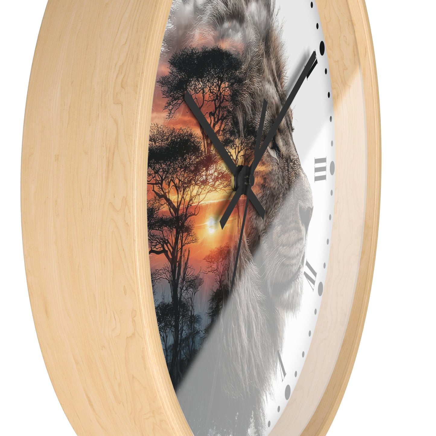 Round wall clock with a light natural wood frame and a printed face featuring a lion silhouette over an African savanna sunset scene, shown on a white background.