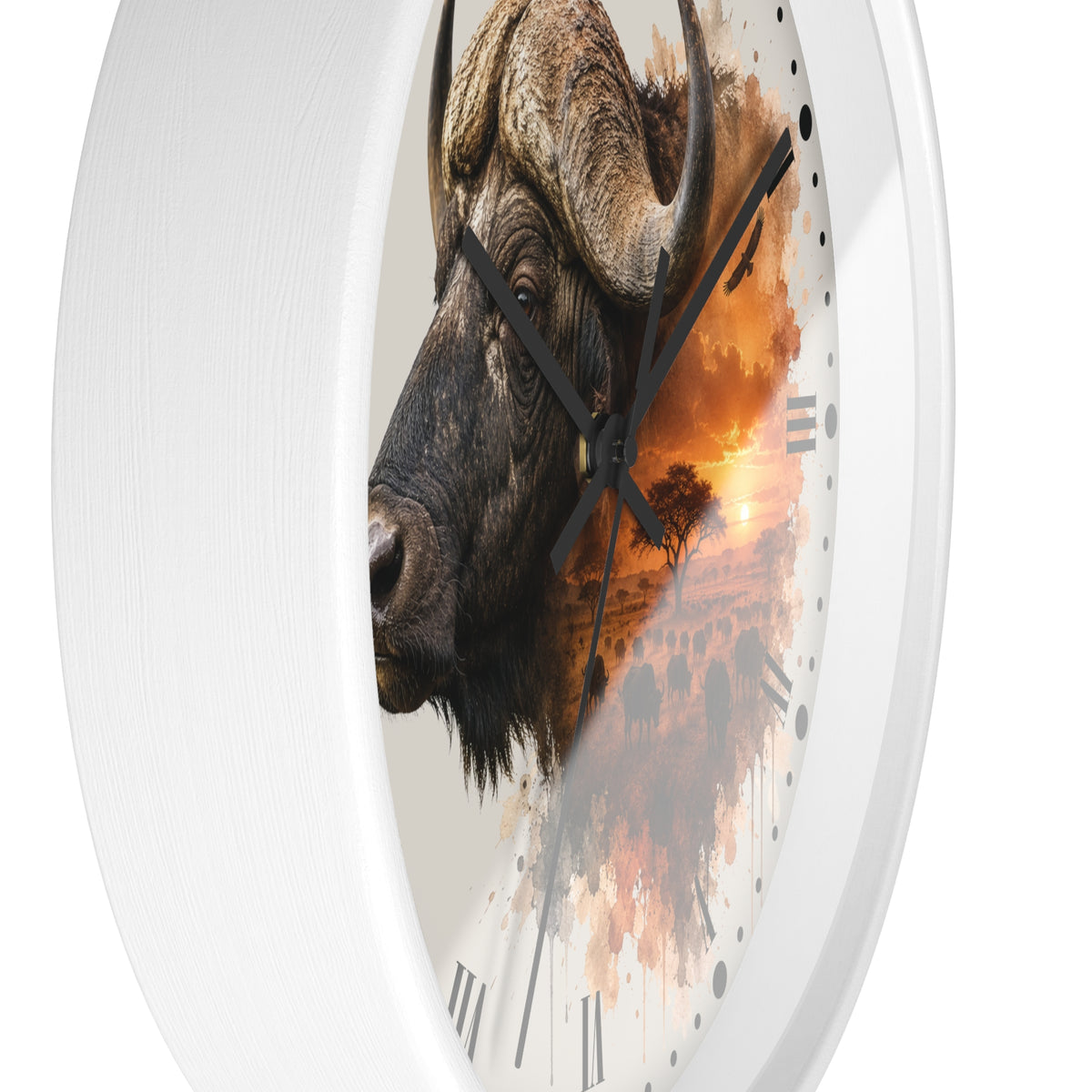A round wall clock with a white frame and a printed design featuring a close-up side profile of a buffalo over an orange sunset landscape, shown against a plain white background.