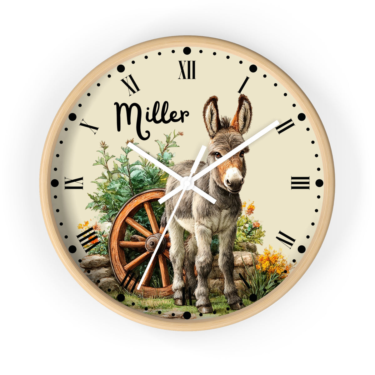 A round wall clock with a light wood frame and a cream dial, featuring a printed illustration of a donkey, a wagon wheel, flowers, and the name 'Miller' in script. The clock is shown against a plain white background.