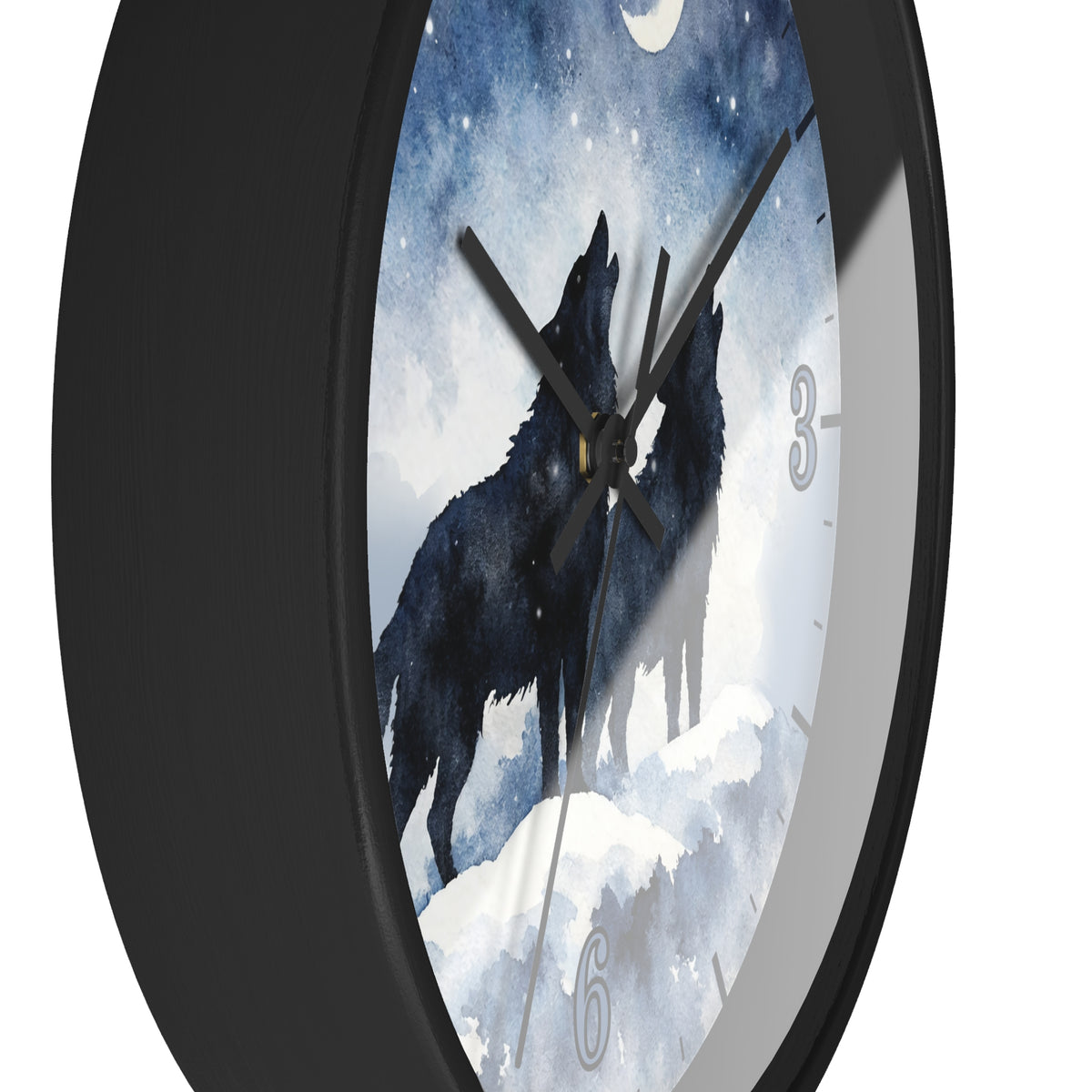 A round wall clock with a black frame and a printed face showing two black howling wolves against a snowy white and blue night sky. The clock is shown at an angle on a plain white background.