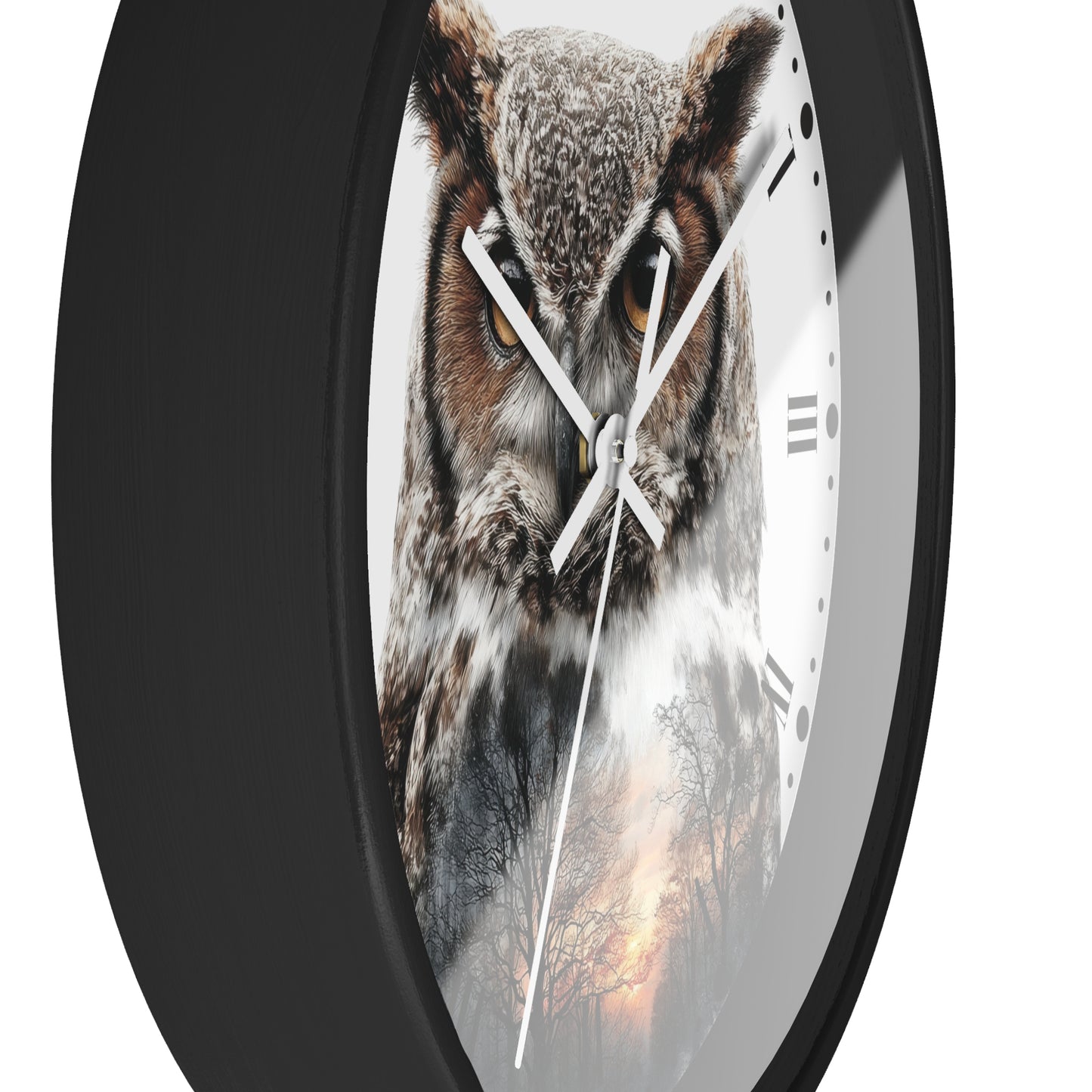 A round wall clock with a black frame and a printed owl face on the dial, shown against a plain white background.