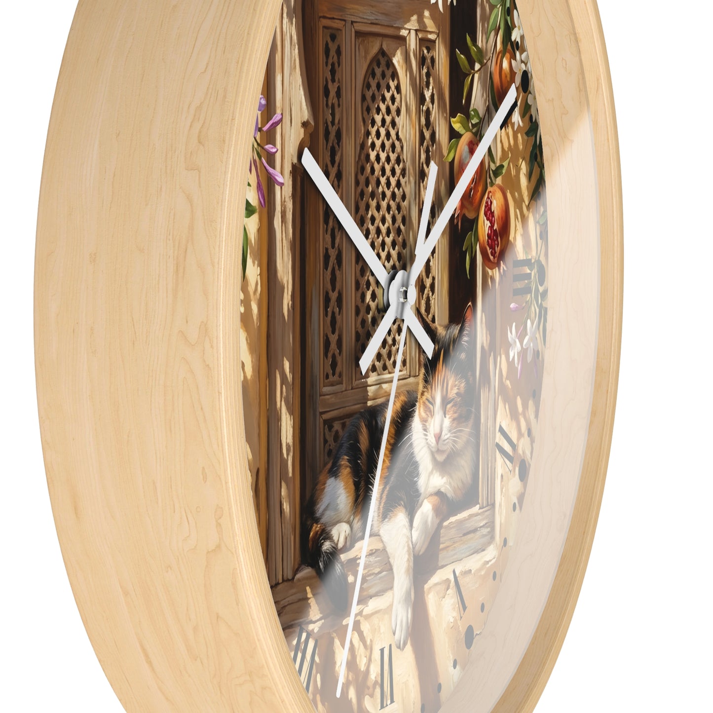 Round wall clock with a light natural wood frame and a printed scene of a calico cat resting on a windowsill, shown against a plain white background.