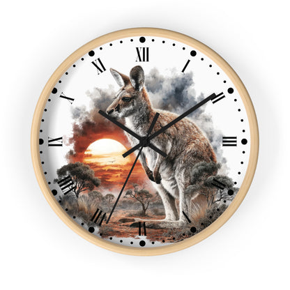 Round wall clock with a light wood frame and a printed scenic dial featuring a kangaroo over an Australian outback landscape at sunset, with black Roman numerals and hands on a white background.