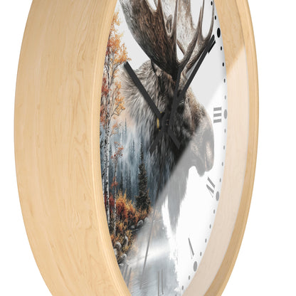 Round wall clock with a light natural wood frame and a printed face showing a moose head over a misty forest scene, with black hands and Roman numerals on a white background.