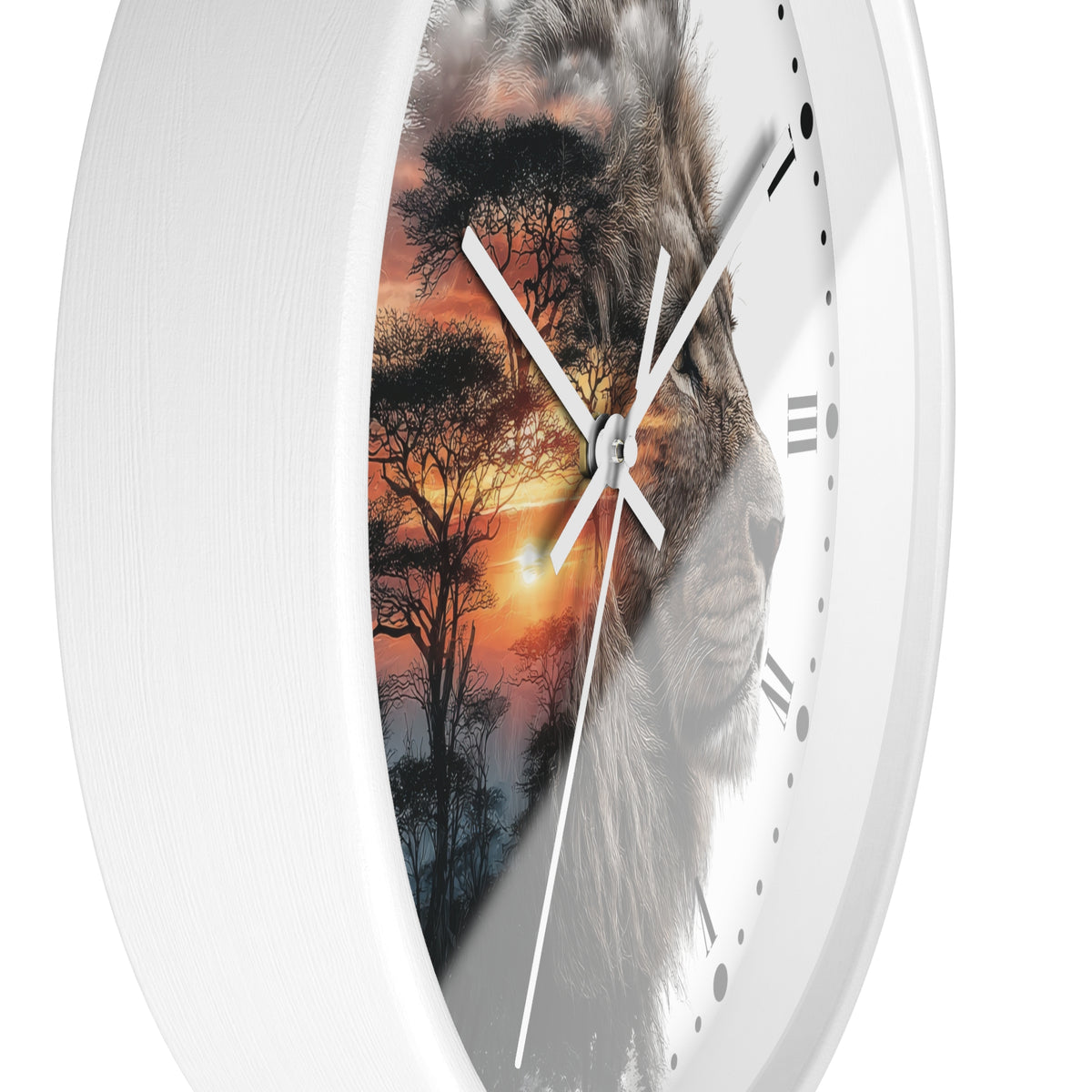 A close-up of a round wall clock with a white frame and a printed design featuring a lion face over an African savanna sunset scene. The clock has white hands, black Roman numerals, and black dot hour markers on a white background.