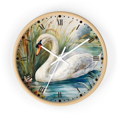 Round wall clock with a light wood frame and a printed swan painting on the face, featuring Roman numerals and white clock hands, shown on a plain white background.