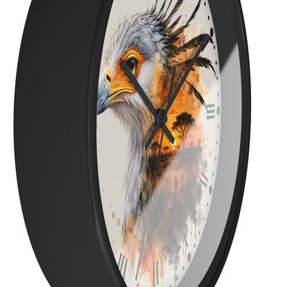 A close-up of a round wall clock with a black frame and a white face featuring a painted bird of prey in gray, orange, and black tones.