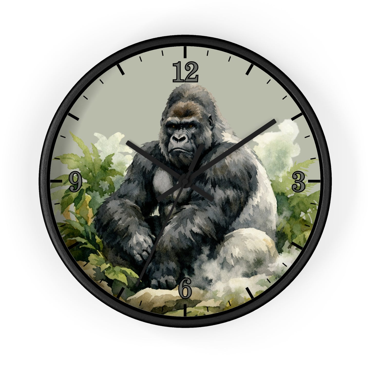 A round wall clock with a black frame and a printed illustration of a seated gorilla among green foliage on the clock face, shown against a plain white background.