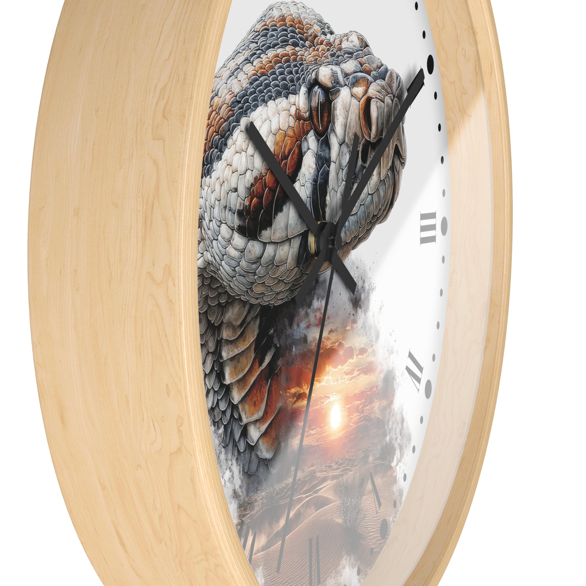 A close-up of a round wall clock with a light natural wood frame and a printed face showing a detailed snake head over a desert sunset scene.