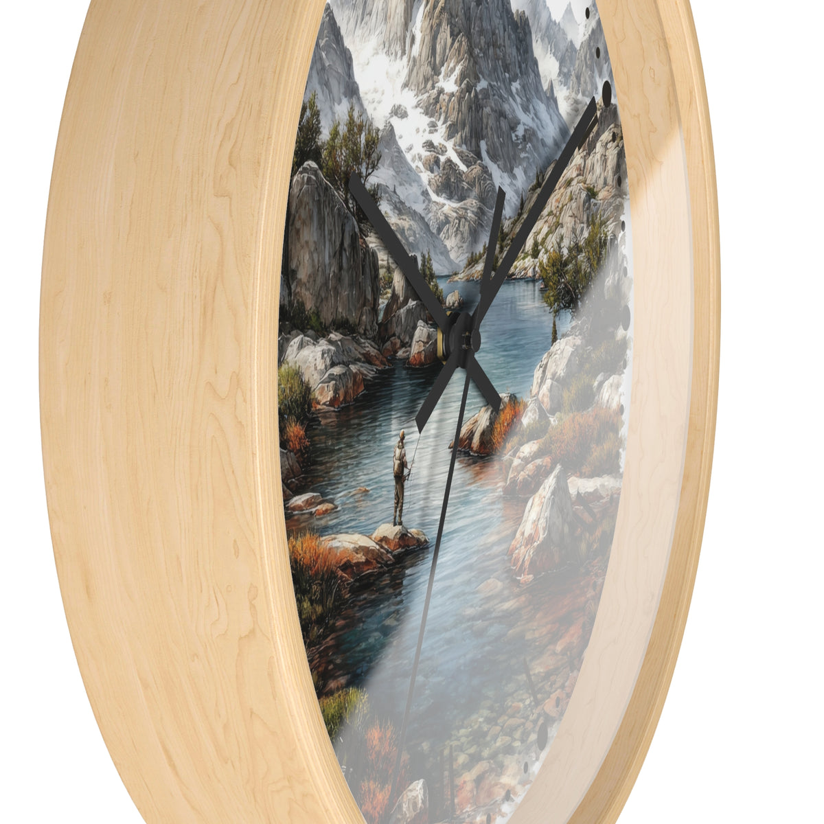 An oval wall clock with a light natural wood frame and a printed scenic dial showing a mountain river landscape with a fisherman. The clock is photographed against a plain white background.