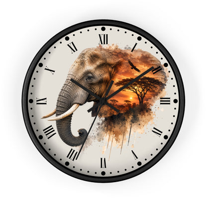A round wall clock with a black frame and Roman numerals, featuring a printed design of an elephant merging into a savanna sunset scene with a bird and tree.