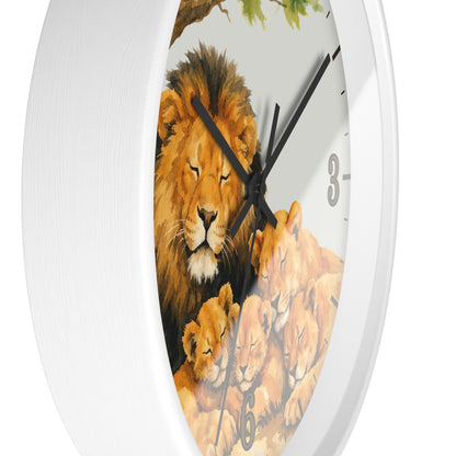 A white round wall clock featuring a printed illustration of a lion and lion cub on the face, with black hands and gray numerals.