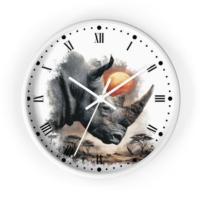 A round wall clock with a white frame and face, featuring a large rhinoceros illustration over a savanna scene with a sun and clouds. The clock has black Roman numerals and black dot hour markers, with white hands.