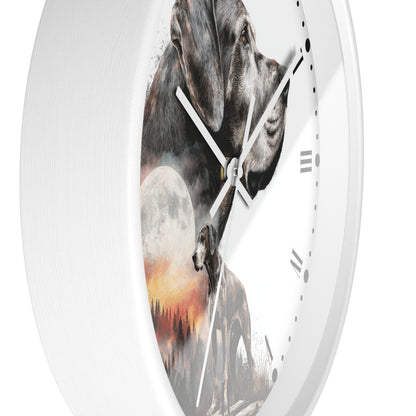 A white round wall clock with a printed design featuring a gray dog, a full moon, and a wolf silhouette over a sunset landscape.